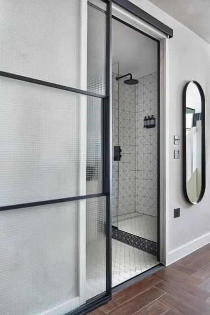 Sliding shower screen in a hotel bathroom