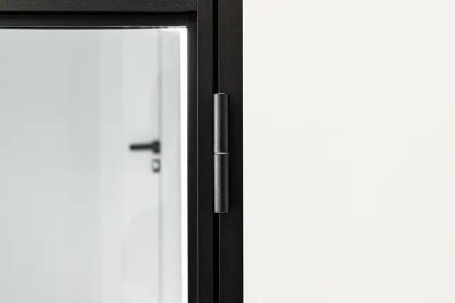 Slim aluminium door in a bright interior